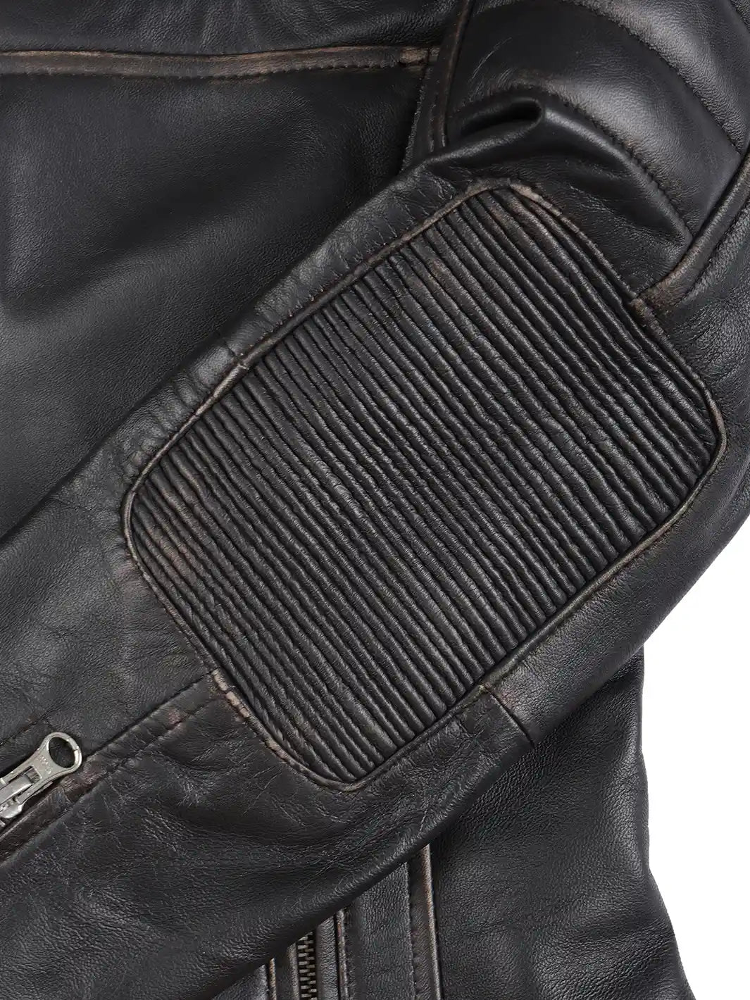 Close-up of a black leather jacket with a textured patch on a white background