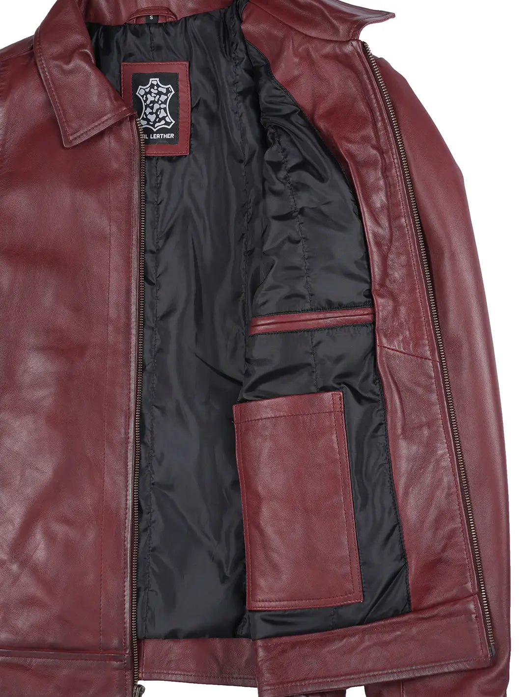 Close-up of a red leather jacket with a brand logo on a white background
